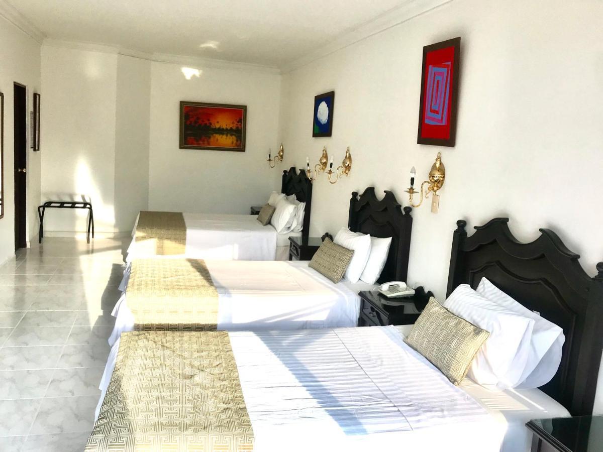 Casa Morales Hotel Internacional Y Centro De Convenciones اباغويه الغرفة الصورة