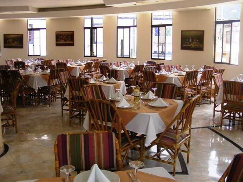 Casa Morales Hotel Internacional Y Centro De Convenciones اباغويه المظهر الخارجي الصورة The dining room at the hotel