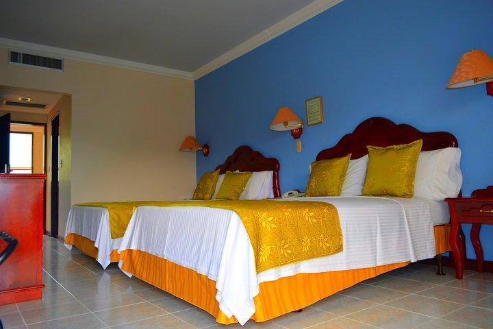 Casa Morales Hotel Internacional Y Centro De Convenciones اباغويه المظهر الخارجي الصورة A room at the hotel